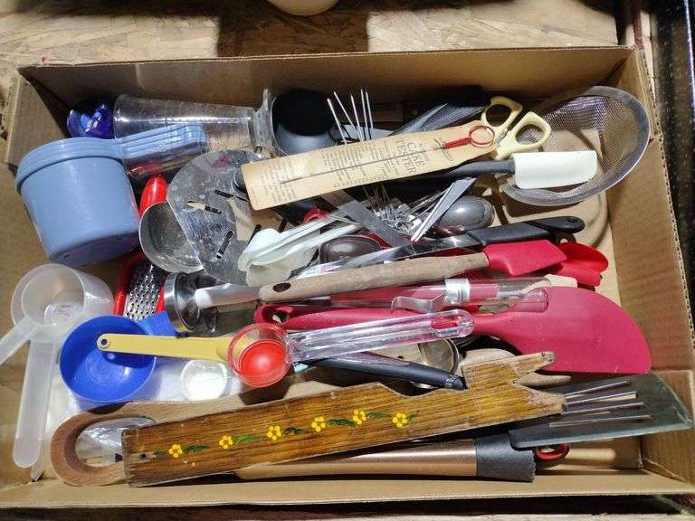 Kitchenware, including spatulas, measuring cups, grater, cake tester