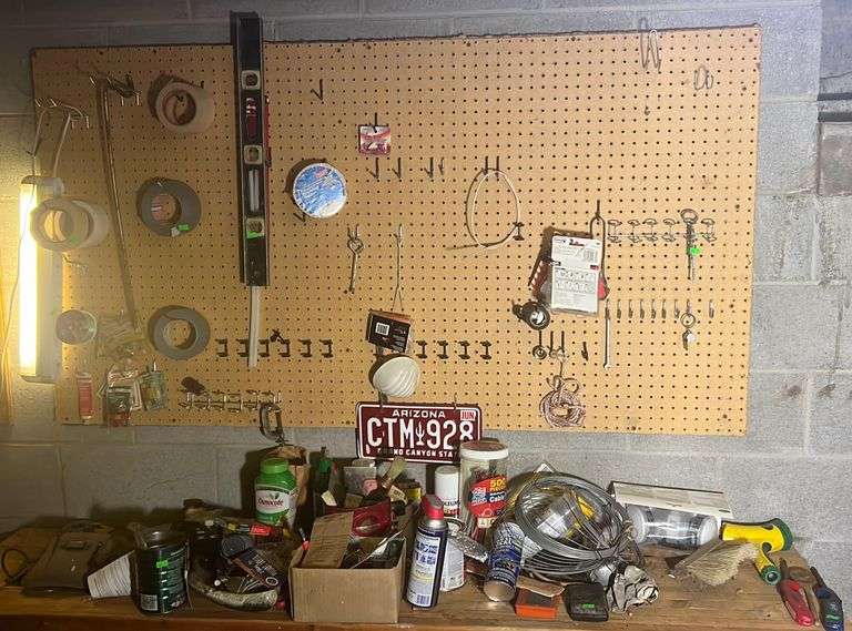 Contents of wall and on top of bench including duct & masking tape