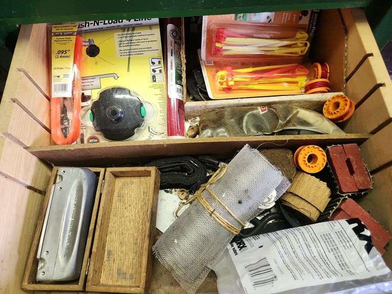 Weed eater parts, zip ties, misc. contents of drawer as shown Metzger