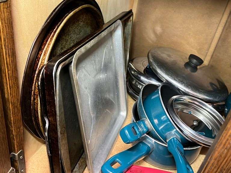Pots and pans, baking sheets,, tfal teal pieces, contents of