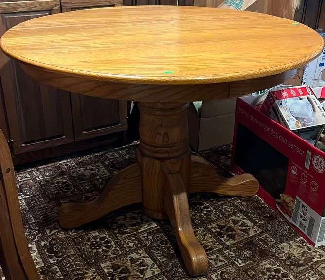 Oak pedestal dining table 42x29" Metzger Property Services LLC