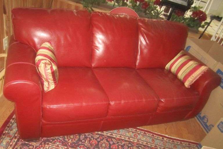 Red leather hideabed sofa Mark Van Hook, Auctioneer