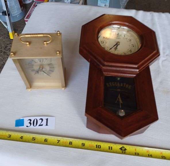 Two battery operated clocks Mark Van Hook, Auctioneer