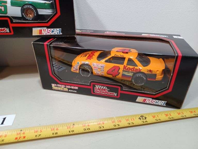 (3) NASCAR diecast cars in Packaging Mark Van Hook, Auctioneer