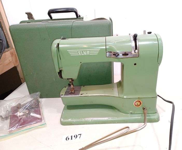 Vintage Elna supermatic sewing machine with manual and attachments in