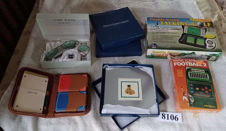 Gift set of sunglasses and watch, 2 new photo frames in boxes, two vintage electronic games, Etc