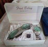 Gift set of sunglasses and watch, 2 new photo frames in boxes, two vintage electronic games, Etc