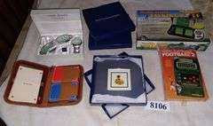 Gift set of sunglasses and watch, 2 new photo frames in boxes, two vintage electronic games, Etc