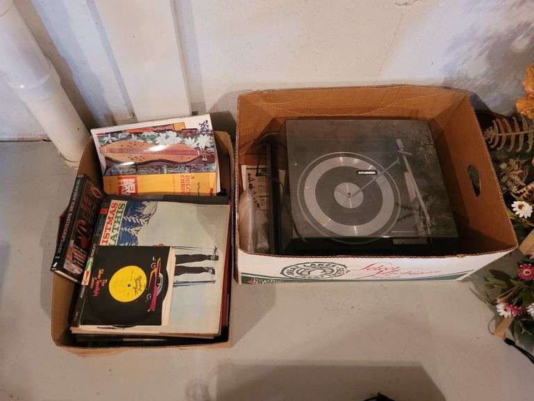 Sylvania Record Player with Vinyl Records in Basement Ness Bros Realtors & Auctioneers