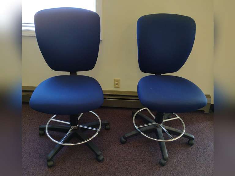 2 Adjustable rolling chairs.