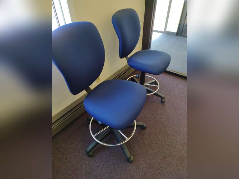2 Adjustable rolling chairs.