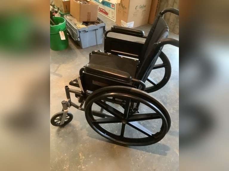Wheel chair, missing leg rest.