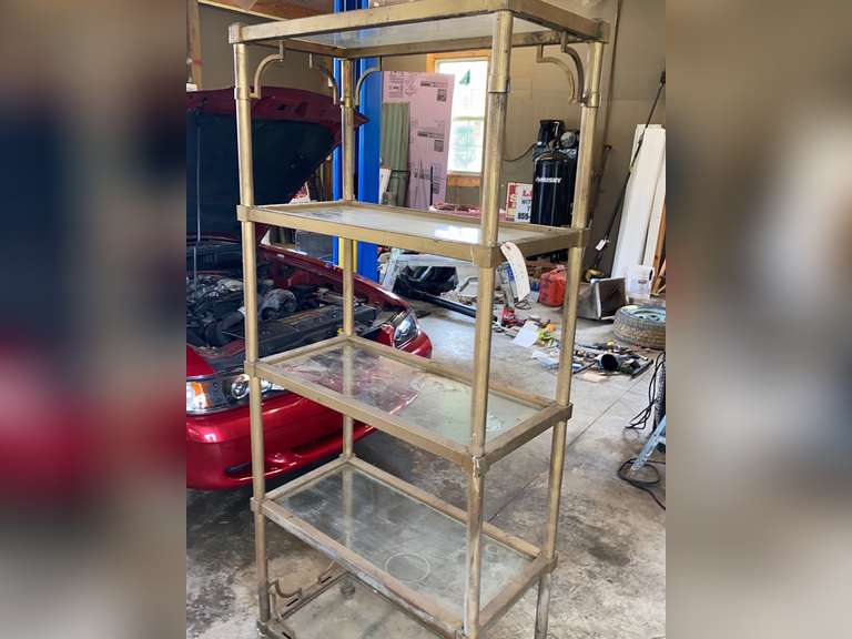 Decorative metal shelving unit with glass shelves, measure 72 inches