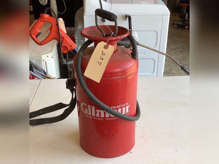 Garden sprayer with strap. Contains diesel fuel.