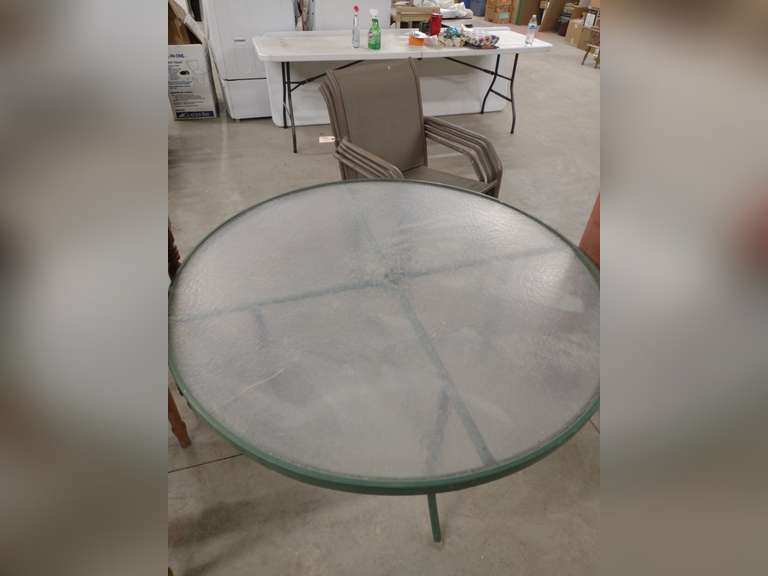 Glass top patio table and 4 chairs, 48" across.