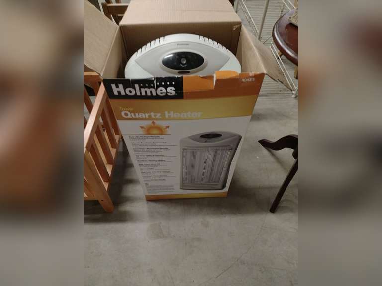 Holmes tower quartz heater. Powered on. Northern Kentucky Auction, LLC