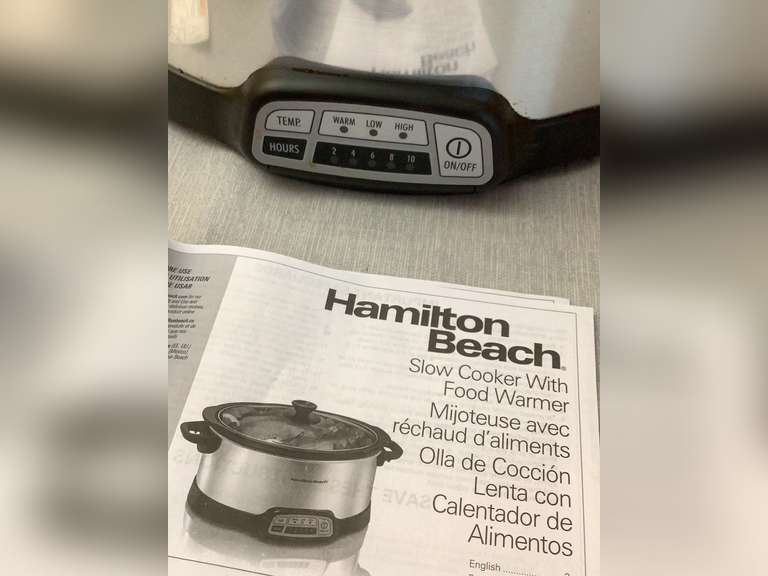 Hamilton Beach Slow Cooker with food warmer. Has locking lid and looks