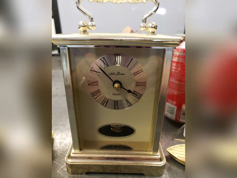 Seth Thomas quartz clock with a Lindon, Timex and Xanadu quartz clocks