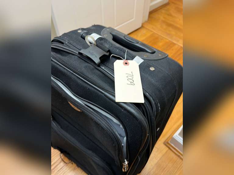 Dockers brand luggage, has a small tear on the front,