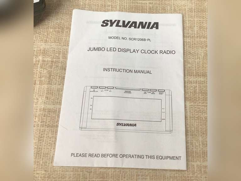 2 Sylvania clock radios and one wall or table clock.