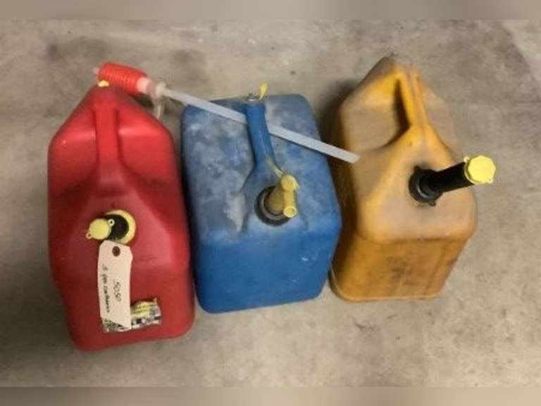 Three plastic gas containers.