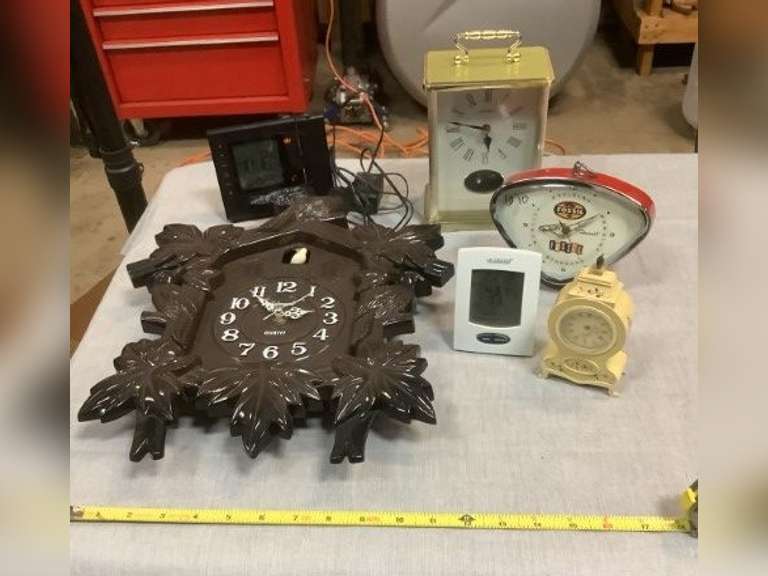Assortment of clocks. Cuckoo clock is made of plastic and missing the