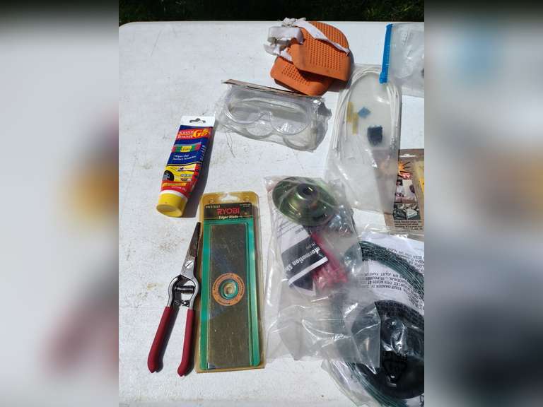 Assorted weed eater, mower parts, etc.