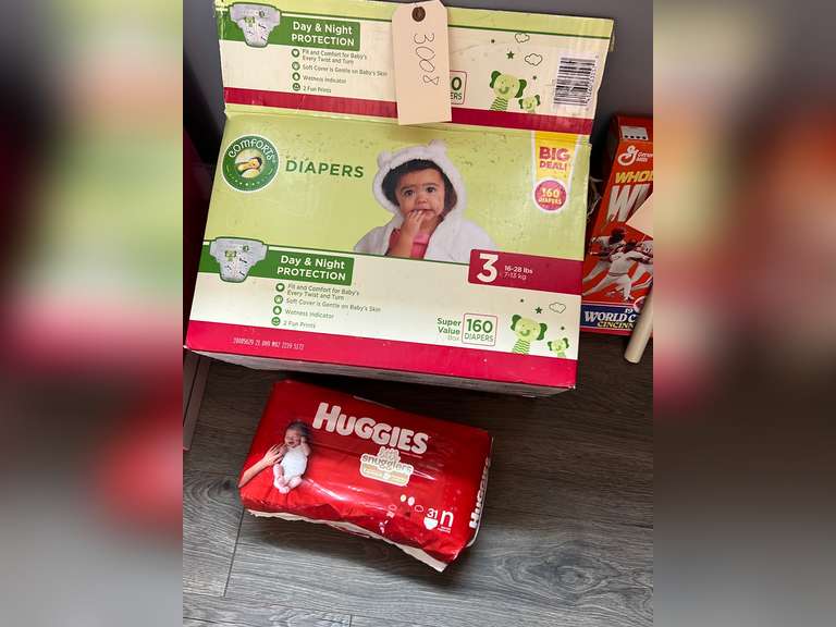 Box with unopened diapers Northern Kentucky Auction, LLC