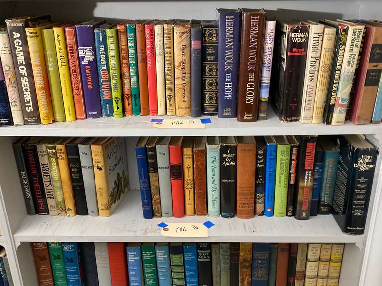 Four shelves full of books, must bring them boxes to pack. Books do not