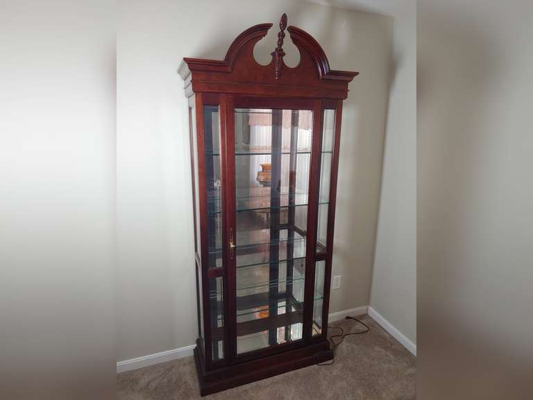 Locking Curio does have one light in the top. Approximately 87