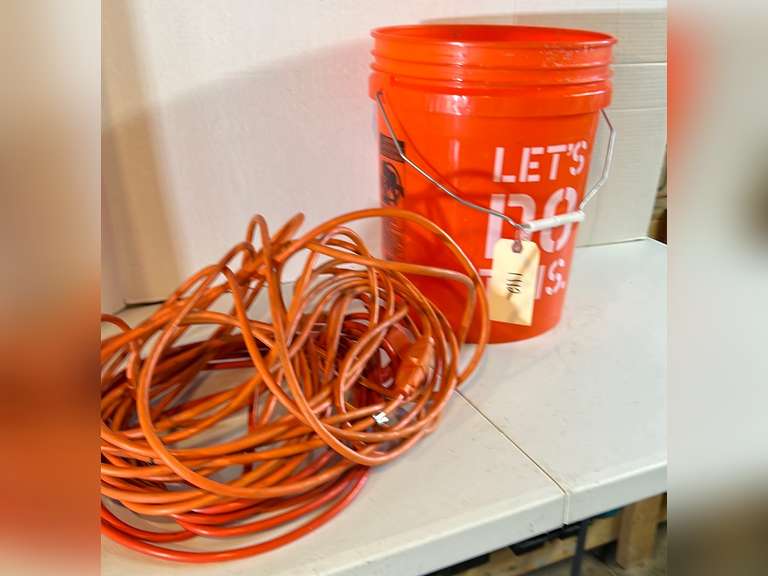5 Gallon bucket with two extension cords.