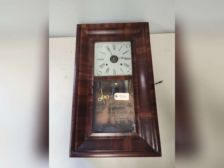 Waterbury Clock Co. wall clock with key