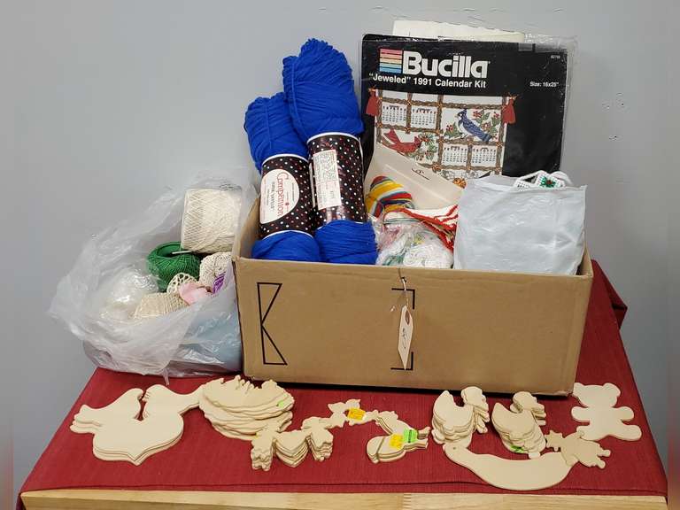 Assortment of wood cutouts, crochet needles, yards, patterns and bag