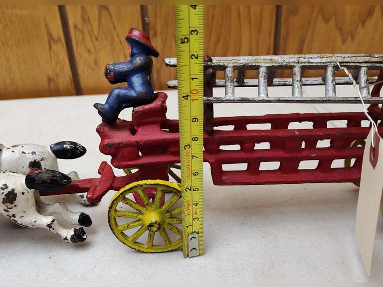 Cast iron fire wagon with horses and men