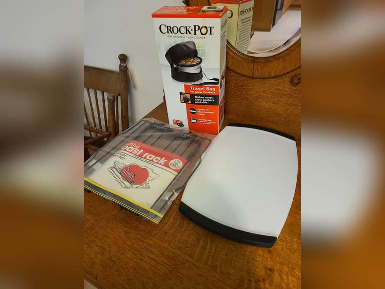 Crock pot travel bag, plastic cutting board and a folding roast rack