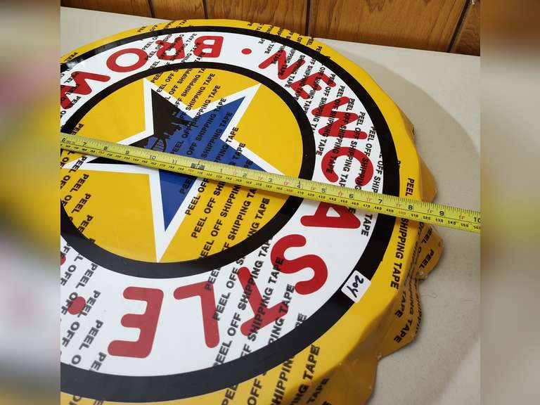 Newcastle Brown Ale metal bottle cap sign still has the plastic on it