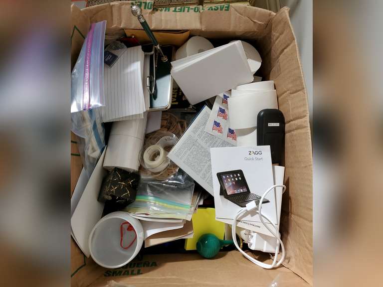 Box full of miscellaneous office supplies and accessories,  keyboard, binders, hanging folders