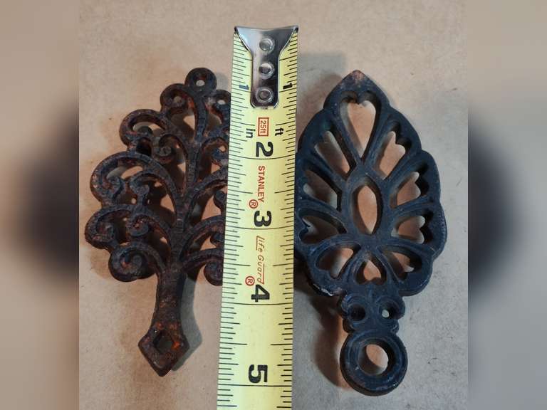 2 mini cast iron trivets