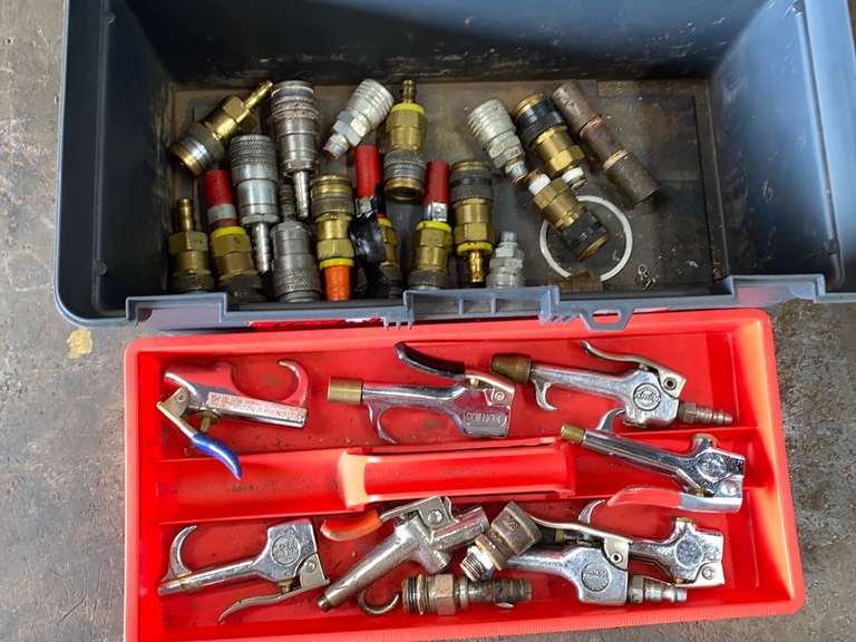 Plastic toolbox with contents, air hose connections and parts
