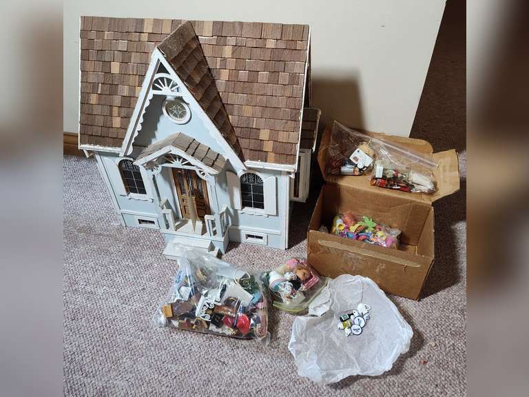 Dollhouse with dollhouse accessories Northern Kentucky Auction, LLC