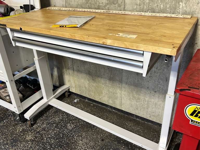 Adjustable height work table with two drawers 52” x 24”, it is