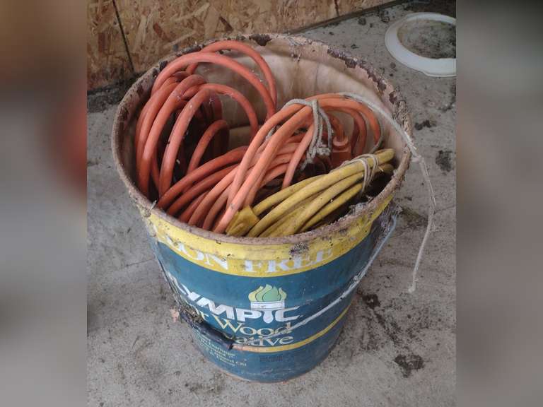 Metal bucket with 3 extension cords. Northern Kentucky Auction, LLC