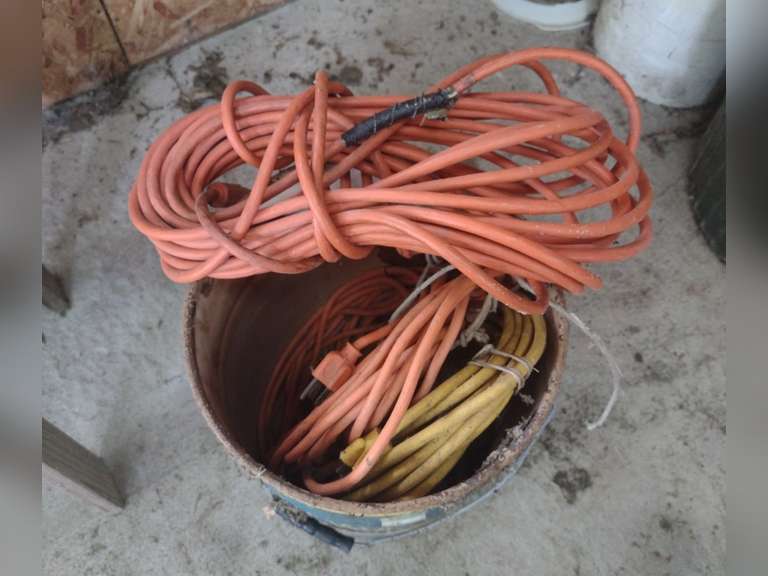 Metal bucket with 3 extension cords. Northern Kentucky Auction, LLC