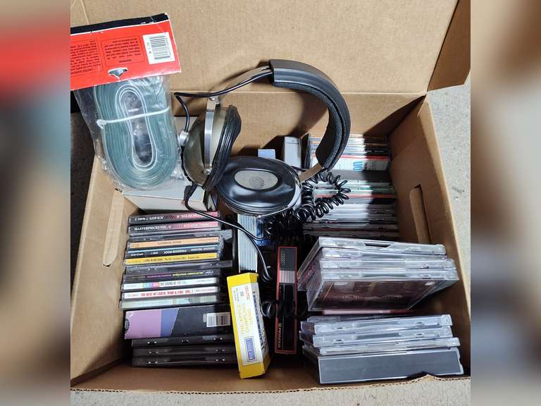 CDs VHS headphones and speaker cord (unknown if all the CD containers