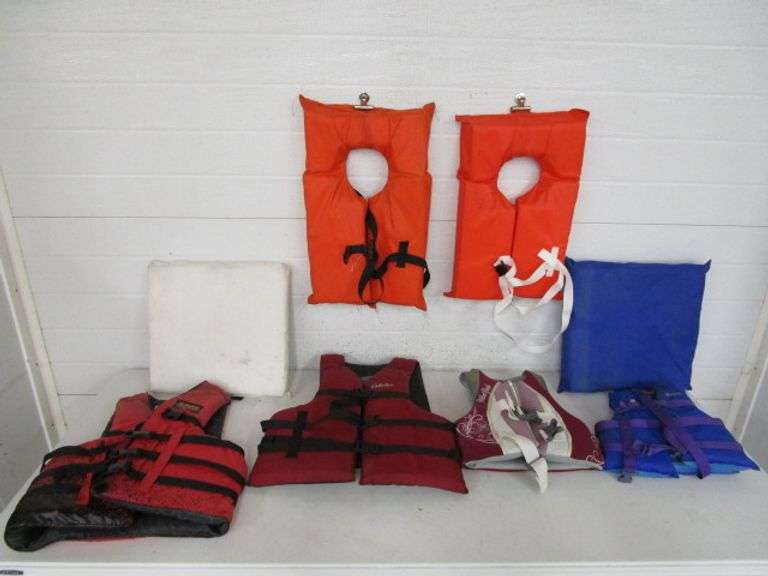 4 Life Vests, 2 Life Preservers & 2 Boat Seat Cushions Oberman