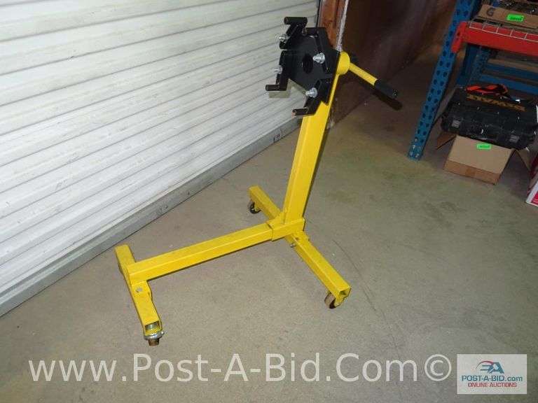 Yellow Engine Stand. Elsenpeter Auctions & Real Estate, Inc. dba Post