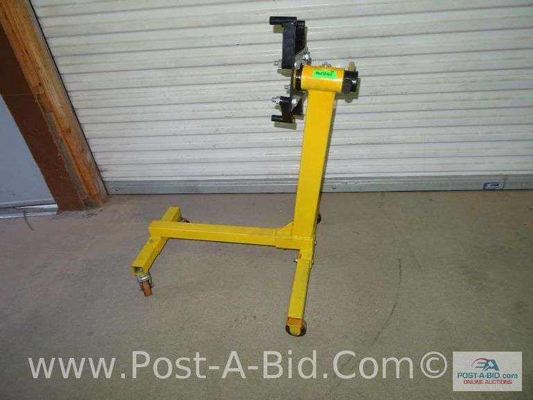 Yellow Engine Stand. Elsenpeter Auctions & Real Estate, Inc. dba Post