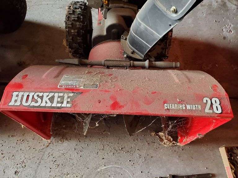 Huskee 28 inch snow blower with 8 HP electric start, appears to be