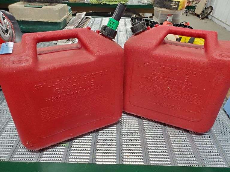 2 plastic gas cans Parrott Marketing Group