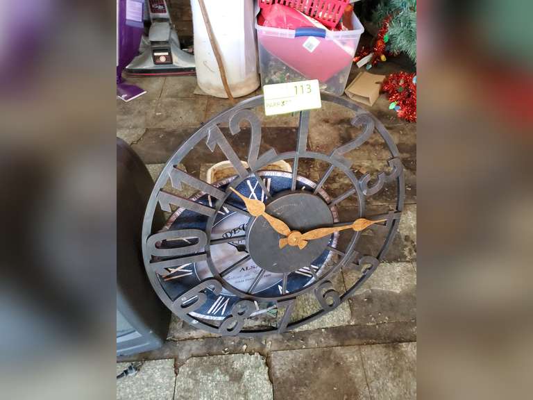 2 wall mount clocks and flower pot Parrott Marketing Group